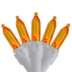 Northlight Set Of 50 Orange LED Mini Christmas Lights 4" Spacing - White Wire